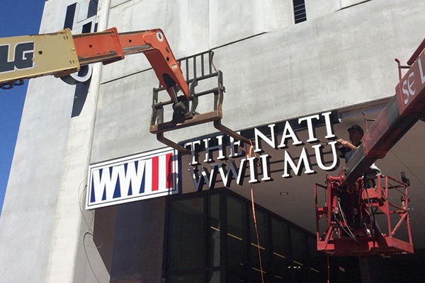 installation of WWII Museum signage